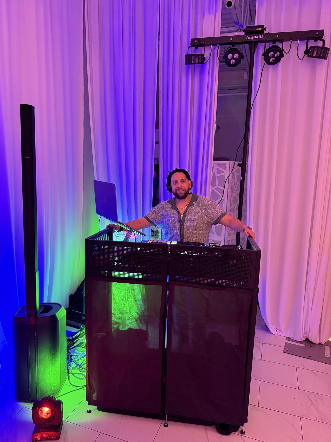 DJ LevSev behind the booth with full lighting rig