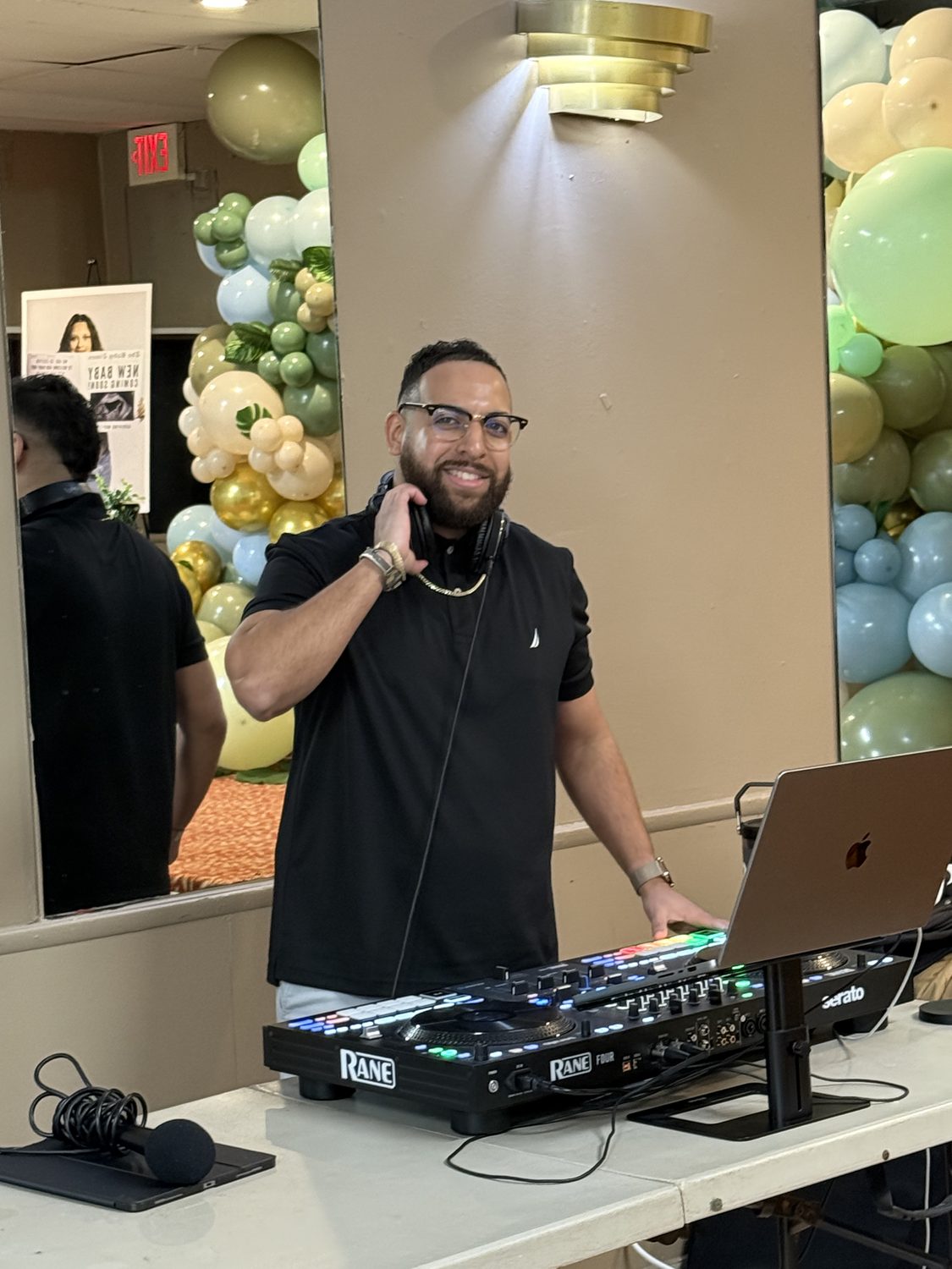 DJ LevSev working the booth at a baby shower